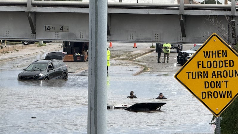Urban roadway under flash flood warning with rising water