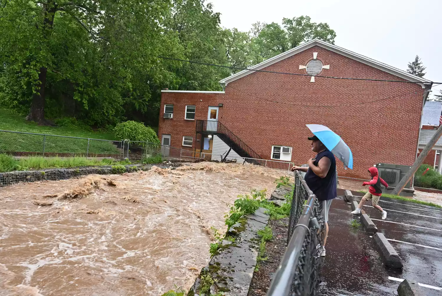 A parking lot submerged by Maryland flooding, highlighting the severity of the 2025 disaster