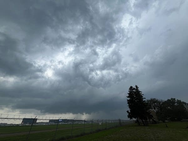 Dark storm clouds above city with a severe thunderstorm warning