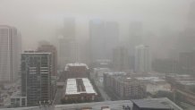 Blowing dust engulfs Chicago city streets during the historic 2025 Chicago dust storm