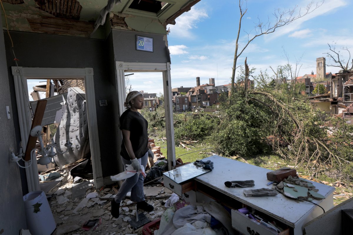 Damage in Plevna KS after tornado, showing uprooted trees and downed power lines